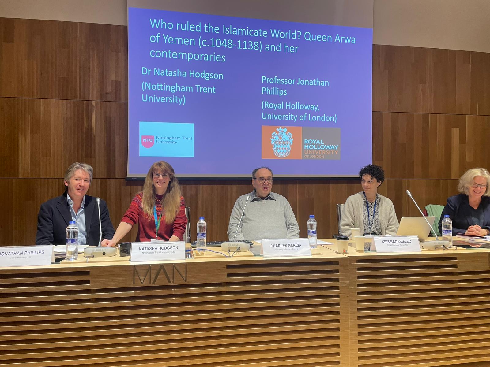 A panel of five people in front of a screen which reads "Who ruled the Islamicate World? Queen Arwa of Yemen (c. 1048-1138) and her contemporaries'.