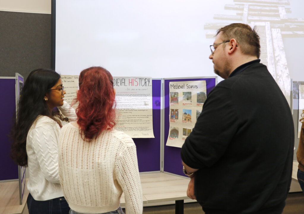 Photograph of students showing their work at the festival.